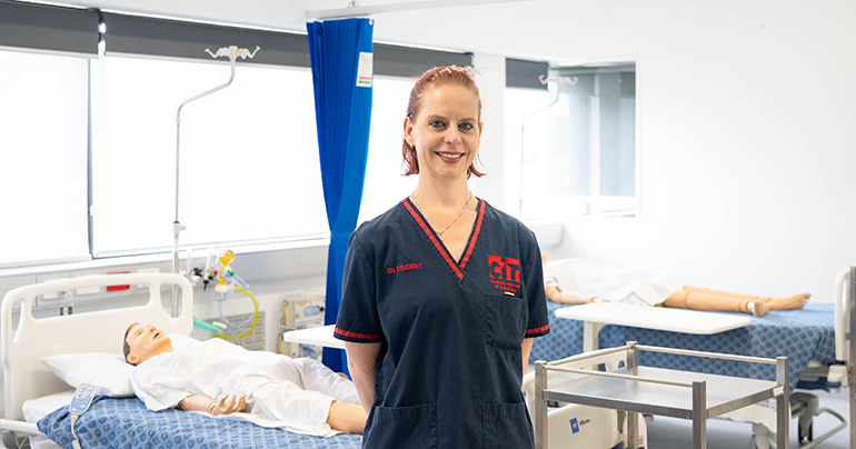 Caitlin CIT Nursing student in the nursing lab hero image